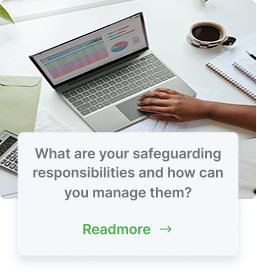 desktop view of laptop with coffee and notpad and hand on trackpad